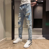 2019 new Korean casual hole jeans men's summer Korean version of the trend of social spirits guys slim men's pants